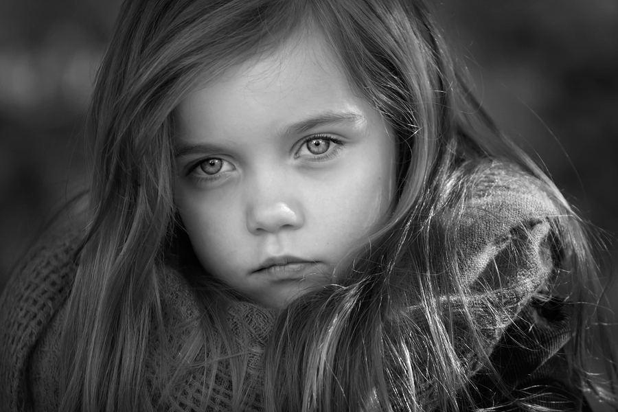 black and white portrait of a beautiful young girl taken outside